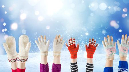 woolen children gloves and winter snow backgroundの写真素材