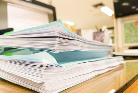 Blue paper document with office equipment on desk,office concept background,design for advertising.
