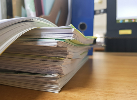 Paper document and office equipment on desk.