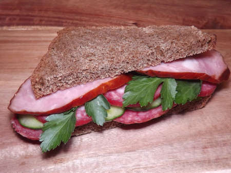 sandwich with different types of sausage and vegetables, quick snack. High quality photoの写真素材
