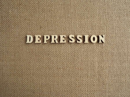 mental illness depression in wooden letters on a black background. High quality photoの写真素材