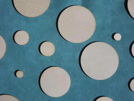 wooden circles of different diameters on blue suede. High quality photoの写真素材