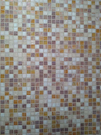 background of white and beige tiles in a small square randomly. High quality photo