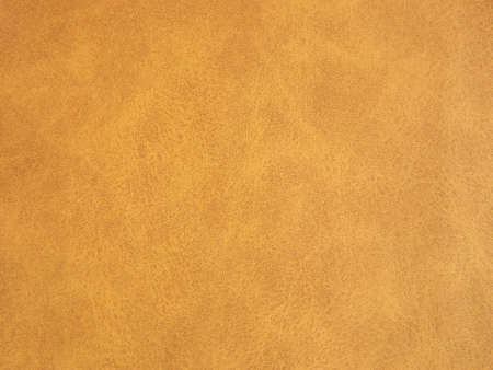 Suede surface in beige and mustard color as a background. High quality photoの写真素材