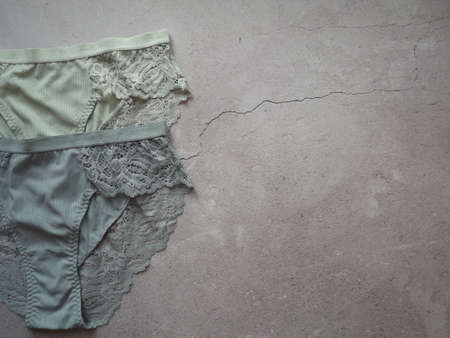 A pair of womens guipure panties on a gray background. High quality photo