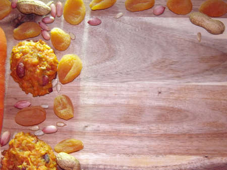 carrot diet cookies with carrots, dried apricots, peanuts and sunflower seeds with space for text....