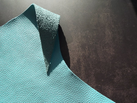 Genuine leather and genuine suede turquoise blue close-up as background. High quality photo