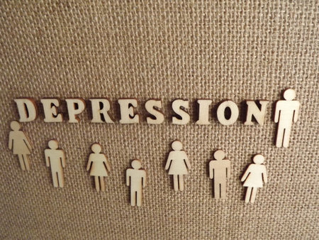 mental illness depression in wooden letters on a black background. high quality photoの写真素材
