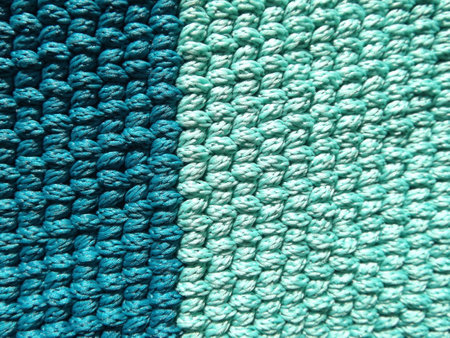 Background turquoise, sea-green, blue crocheted stripes of polyester cord. high quality photoの写真素材