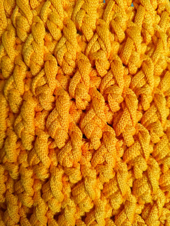The process of crocheting a handbag made of cord and leather accessories. High quality photo