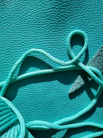 Genuine leather and genuine suede turquoise blue close-up as background. High quality photoの写真素材