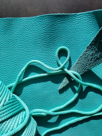 Genuine leather and genuine suede turquoise blue close-up as background. High quality photoの写真素材