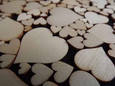 Wooden hearts on a black background as a postcard for the holidays. High quality photoの写真素材