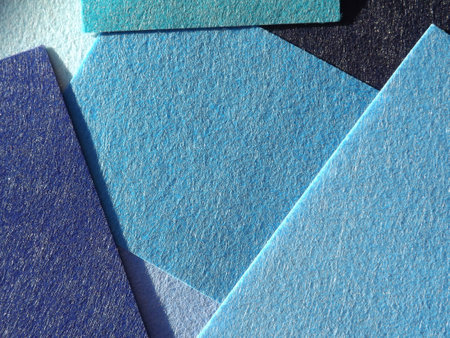 The textured surface is blue as a background. Felt. High quality photo