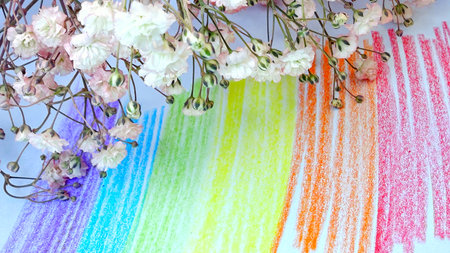 bouquet of white and pink flowers on the background of the rainbowの写真素材