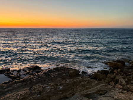 Sunset over the sea in Sicily, Italy. Long exposure.の写真素材