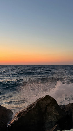 Sunset on the Mediterranean Sea in Tarragona, Spainの写真素材
