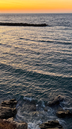 Sunset over the Mediterranean Sea in Tossa de Mar, Spainの写真素材