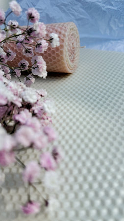 Wedding candles and gypsophila flowers on the tableの写真素材