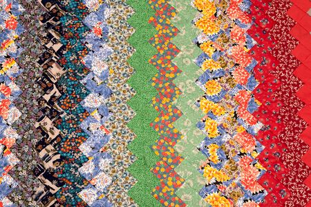 Flowers ornament patchwork quilt fragment, colorful handmade ethnic blanket.の写真素材