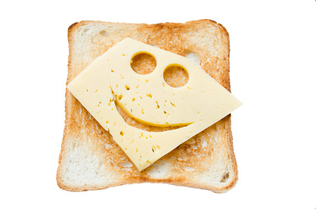Traditional Homemade Grilled Cheese Sandwich on Whole Wheat Bread with a smiling cheese