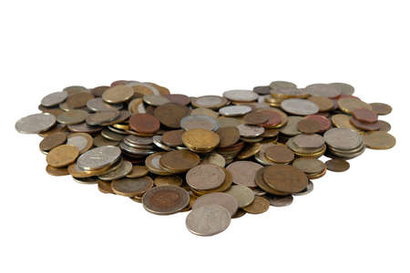 Heart from coins on white