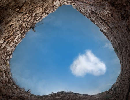 In ancient tower overhead visible cloud in the shape of a heart. Concept.の写真素材