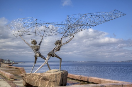 Sculpture of TWO FISHERMEN, CASTING A NET INTO THE LAKE in Petrozavodsk  Karelia, Russiaの写真素材