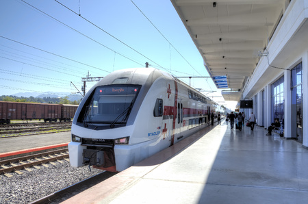 Doubledacked train Stadler Kiss (Tbilisi - Batumi) on railway station of Batumi, Georgiaのeditorial素材
