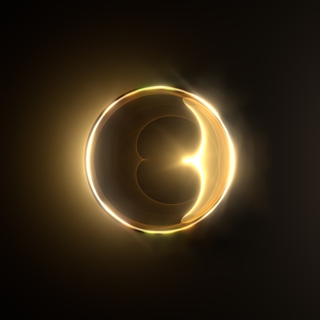 Golden fiery ring isolated on black background の写真素材