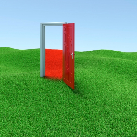 Green lawn with mysterious door opened to another realityの写真素材