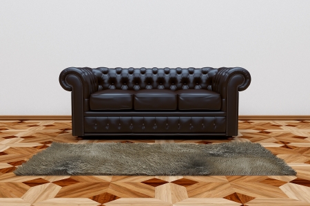 3D render of black leather sofa and brown carpet on wooden parquet.の写真素材