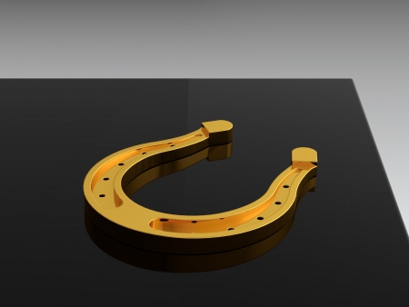 3D render of gold horseshoe on black tableの写真素材