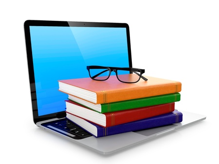 Laptop stack of books and glasses isolated on white background  Electronic education concept の写真素材