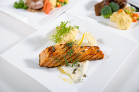 Salmon Stacks with Lemon on white tableの写真素材