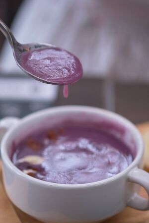 White cauliflower and purple sweet potato soup and selective focusの写真素材