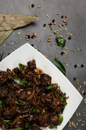 MUTTON PEPPER FRY:

Boneless piece of meat cooked in a pan with spices and masala which is enhanced with heavenly pepper flavour.の写真素材