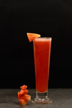 Glass of fresh watermelon juice on a black background. Close up.の写真素材