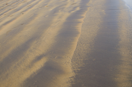 Wet sand of Atlantic ocean for texture or backgroundの写真素材