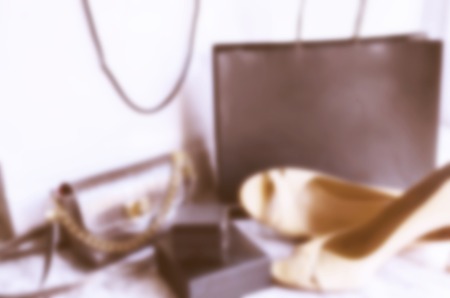 Modern blurred image of shopping bas and women accessories, shoes, bag, jewelry box. Sale or Black Friday backgroundの写真素材