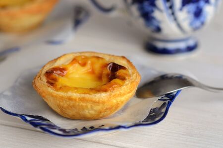 Pasteis de Belem, l Portuguese egg tart pastries with coffee at Lisbon cafe,Portugal. Pastel de nata sweets making using traditional methods and according to the Jeronimos Monastery secret recipe. の写真素材