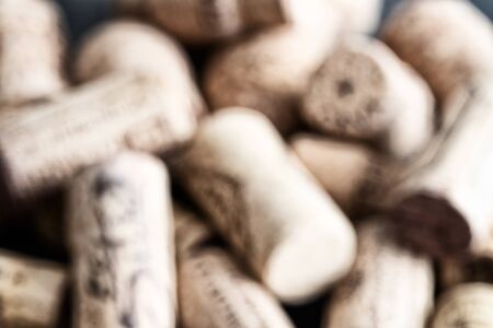Blurred image of assorted used wine corks as background for design.の写真素材