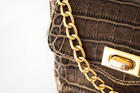 Close up offashion bag with gold chain on white background.Woman Woman accessory detail. の写真素材