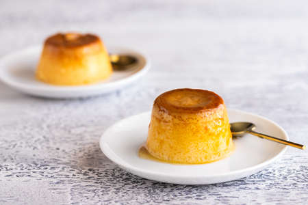 Flan dessert on the plate .Popular crÃ¨me caramel dessert background with copy space.の写真素材