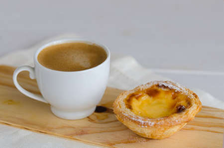 Famous Pasteis de Belem, Portuguese egg tart pastries with coffee at Lisbon cafe, Portugal.の写真素材