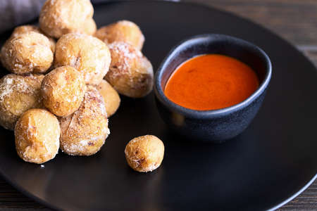 Famous Canary Islands dish, Papas Arrugadas (wrinkly potatoes with salt) and Mojo picon (red spicy...