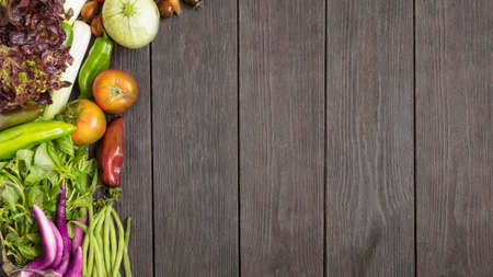 Different vegetables on wooden background. Healthy eating concept. Top view.