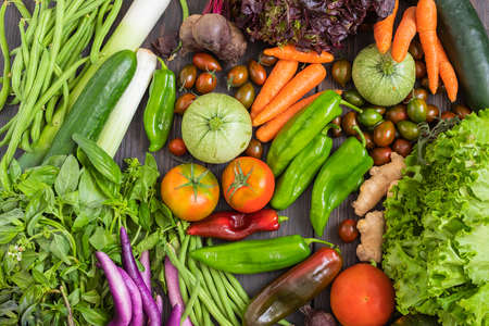 Different vegetables on wooden background. Healthy eating concept. Top view.