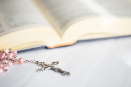 Close up of the Cross in open Holy Bible. Faith, spirituality and Christianity religion concept.