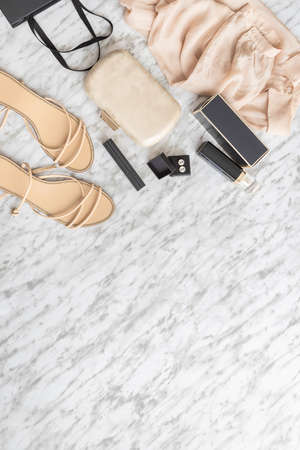 Fashion and Beauty blog concept. Elegant Woman accessories, clothing, shoes, bag, makeup and perfume white gray background. Blogging flat lay.の写真素材